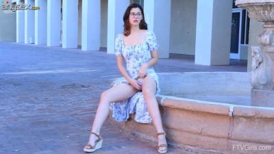 Brunette beauty Elle is feeling her sweet muff in a public place