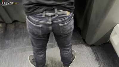 Dominant brunette fucks her boyfriend with a strap on in a public toilet